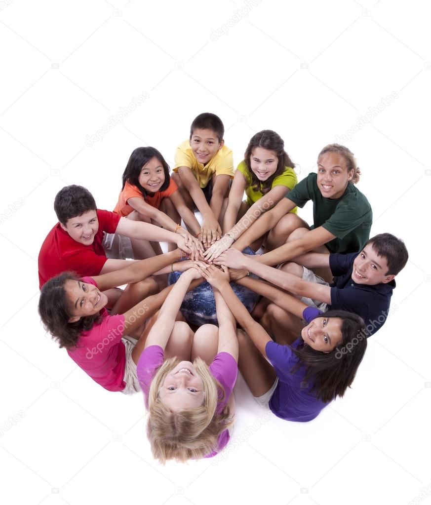 Children of different ethnicities with hands together