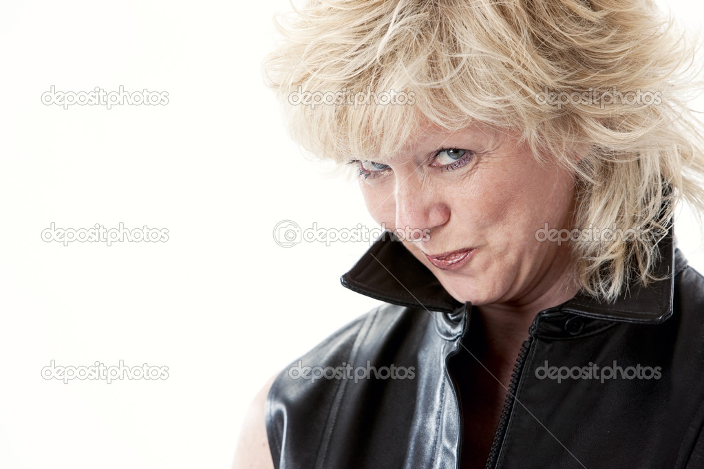 Caucasian mid adult woman with sneaky coy expression