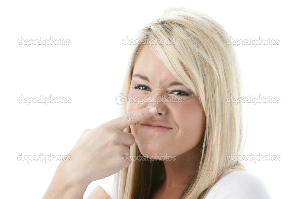 Caucasian young woman touching her nose
