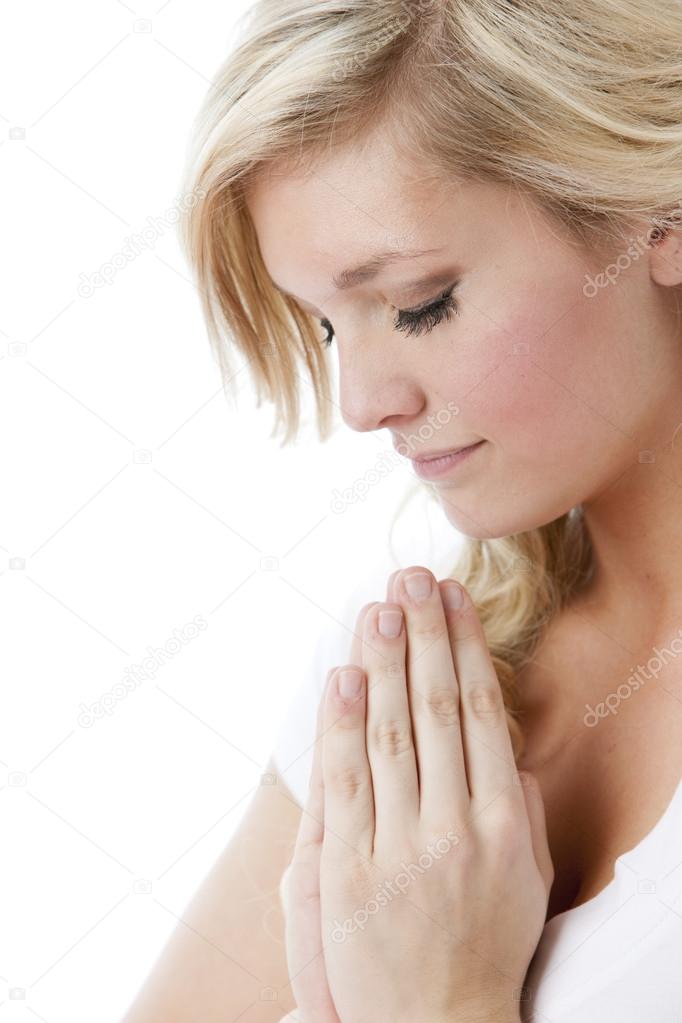Caucasian young woman praying