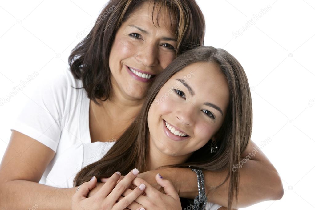 Smiling hispanic mother and teenage daughter