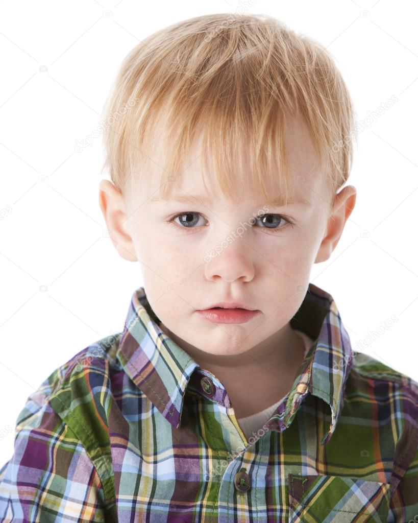Headshot of sad toddler little boy