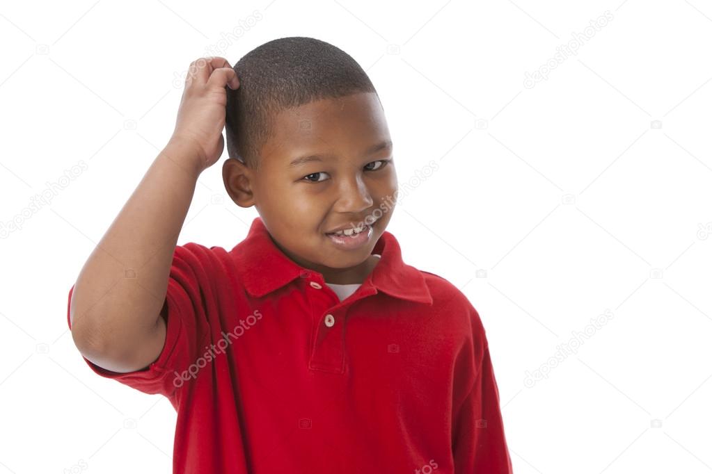 African american little boy scratching his head as if he is thinking or confused