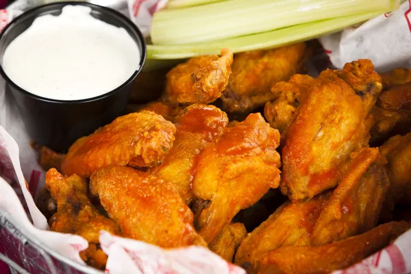 Food and Drink. An appetizer of spicy, saucy Buffalo chicken wings — Stock Photo, Image