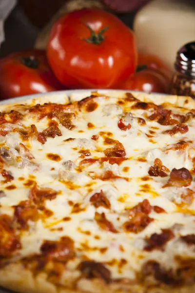 Food and Drink. A zesty all meat pizza. — Stock Photo, Image