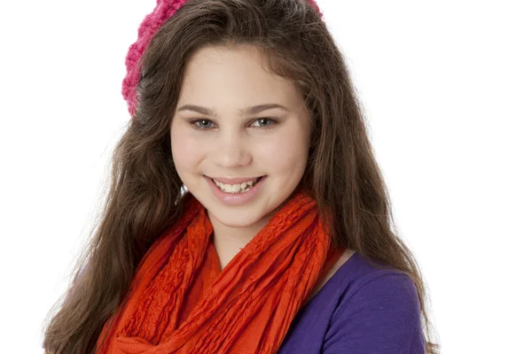 Real. Smiling caucasian teenage girl wearing bright colorful clothes with a hat and scarf — Stock Photo, Image