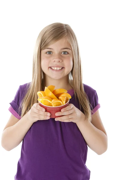 Healthy Eating. Caucasian little girl holding bowl of freshly sliced oranges — Stock Photo, Image