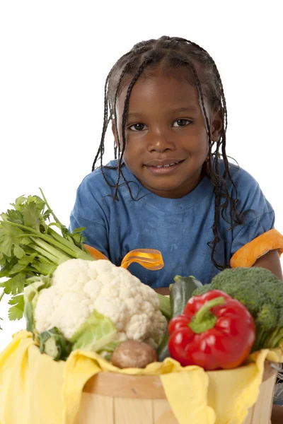 Healthy Eating. Black little boy holding a basket with an arrangement of vegetables — Stock Photo, Image