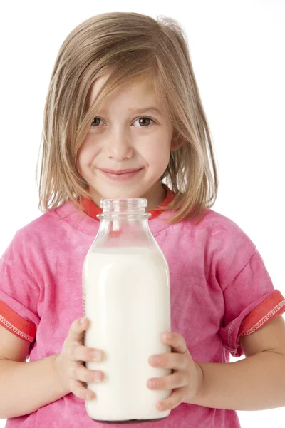 Healthy Eating. Caucasian little girl holding a fresh bottle of milk — Stock Photo, Image