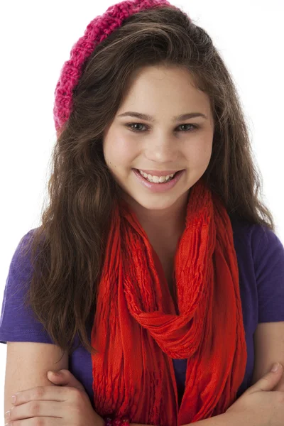 Real. Smiling caucasian teenage girl wearing bright colorful clothes with a hat and scarf Royalty Free Stock Photos