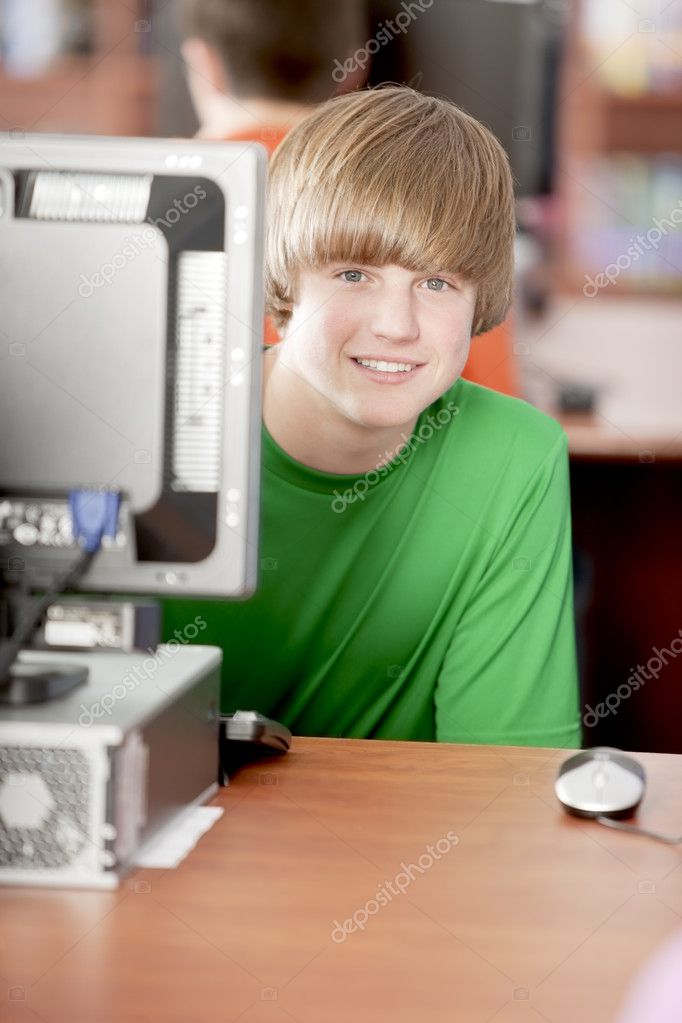 Education. Teenage high school student using a computer in the school