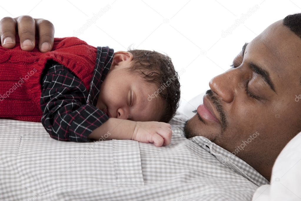 African american father sleeping quietly with his baby son