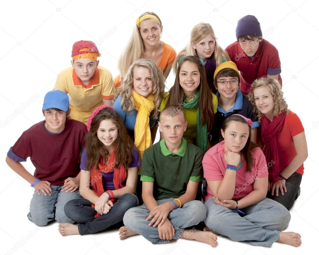 Diversity. Group of teenage girls and boys sitting together in colorful clothes