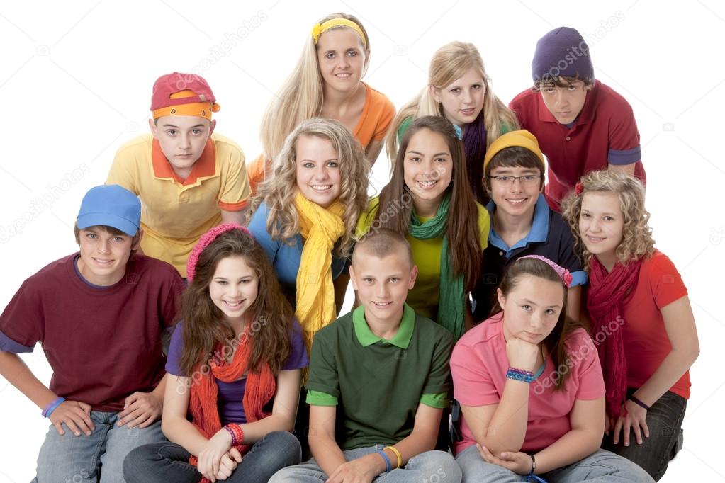 Diversity. Group of teenage girls and boys sitting together in colorful clothes