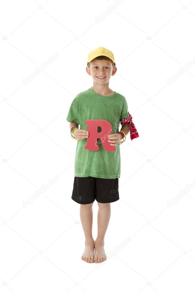 Human Alphabet. Caucasion boy holds Letter R