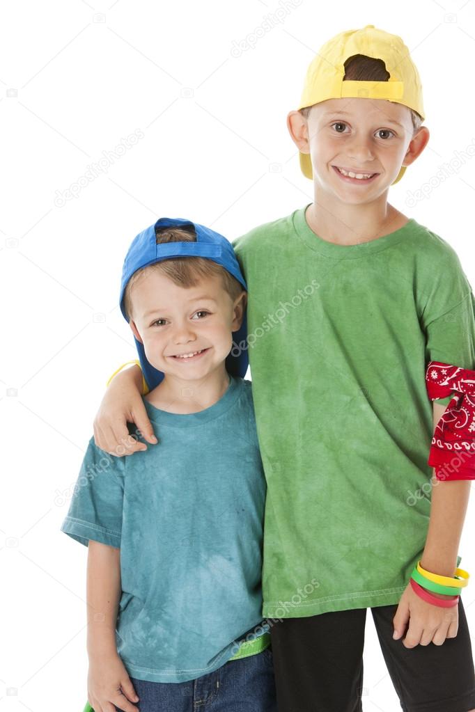 Real. Caucasian little boys wearing bright clothes and baseball caps
