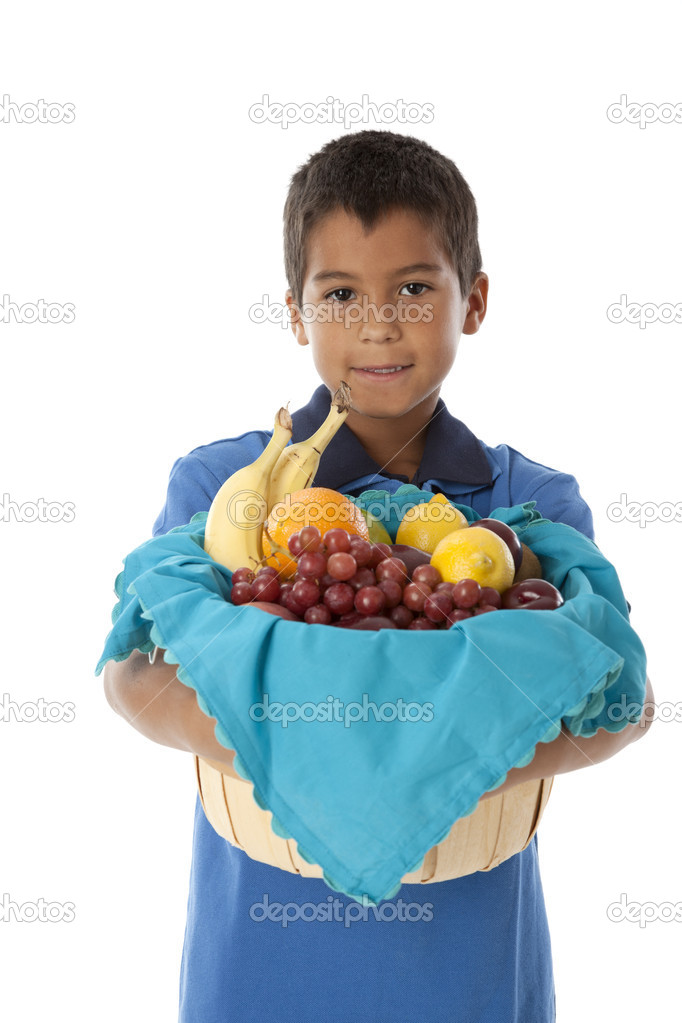 Healthy Eating. Hispanic little boy holding a basket arranged with fresh fruits