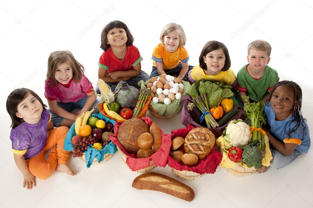 Healthy Eating. Diverse group of children holding baskets with the food groups of fruits
