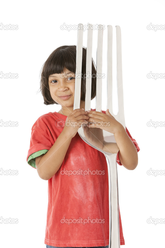Healthy Eating. Mixed Race little girl holding an oversized fork as an eating utensil