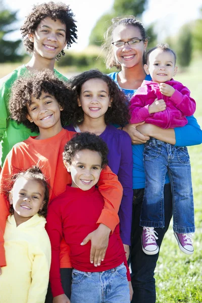 Mixed race caucasian and african american group of brothers and sisters — Stock Photo, Image