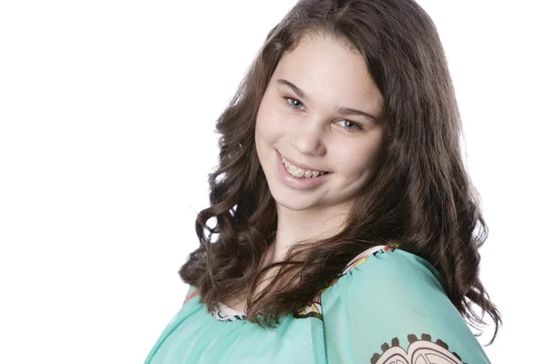 Smiling teenage girl with long brown hair. — Stock Photo, Image