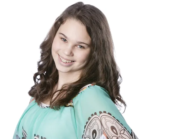 Smiling teenage girl with long brown hair. — Stock Photo, Image