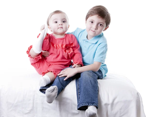 Caucasian little boy and his baby girl sister — Stock Photo, Image