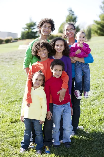 Mixed race caucasian and african american group of brothers and sisters Royalty Free Stock Images