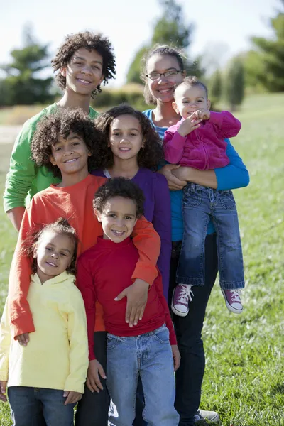 Mixed race caucasian and african american group of brothers and sisters Stock Photo