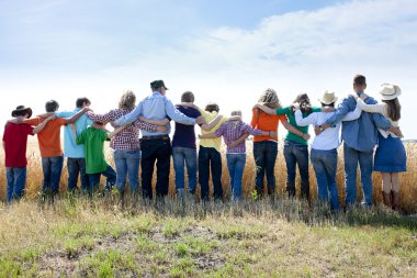 A joyful religious group of family and friends clipart