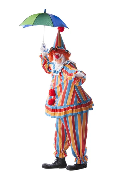 Clowns. Erwachsener männlicher Clown hält einen bunten Regenschirm hoch — Stockfoto