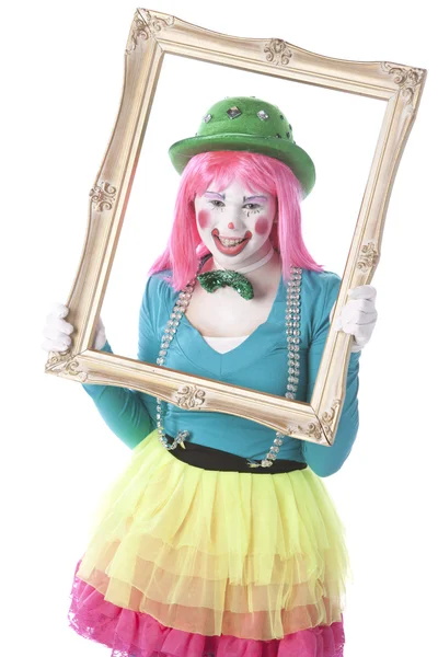 Pagliacci. Giovane clown femminile adolescente regge una cornice — Foto Stock