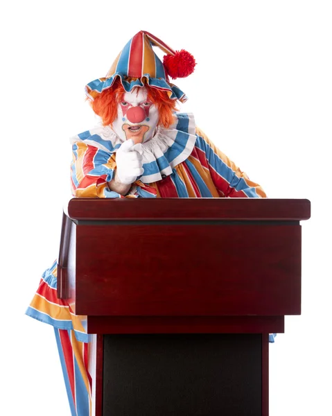 Clowner. vuxen clown stående på ett podium håller tal — Stock fotografie