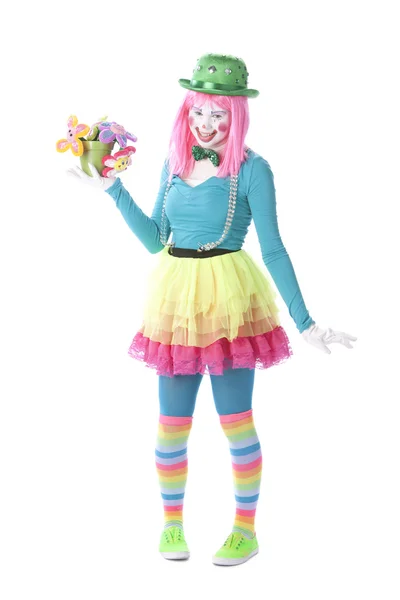 Clowns. Young teenage female clown holding a pot of flowers — Stock Photo, Image