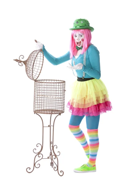 Clowns. Young teenage female clown opening a basket — Stock Photo, Image