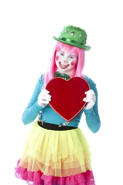 Clowns. Young teenage female clown holding a valentine heart — Stock Photo, Image