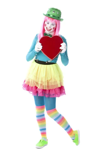 Clowns. Young teenage female clown holding a valentine heart — Stock Photo, Image