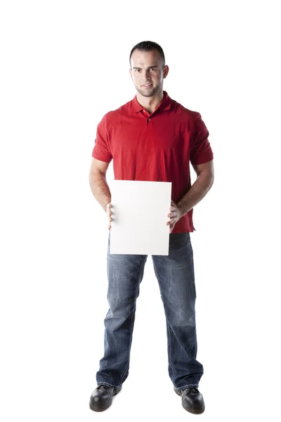 Caucasian young adult male standing holding a blank white sign — Stock Photo, Image