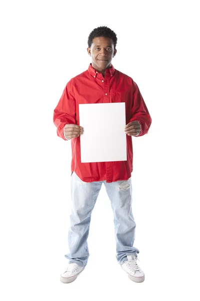 Young adult black man holding a blank white sign — Stock Photo, Image