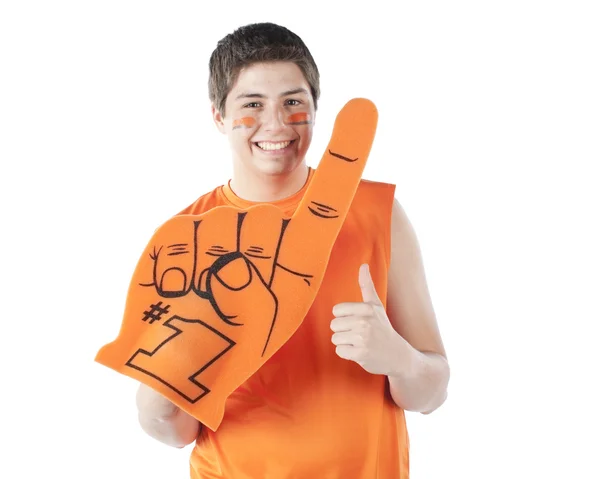 Aficionados al deporte. Hispano macho deportes ventilador raíces para el naranja equipo con espuma dedo y cara pintura — Foto de Stock