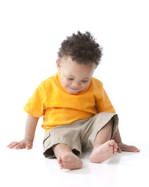 African american little boy wearing a bright orange shirt — Stock Photo, Image