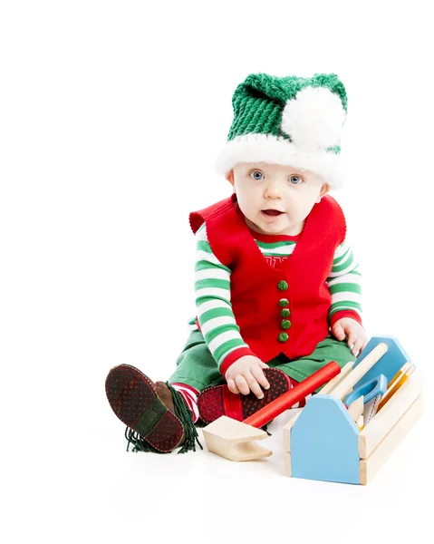 A baby boy ,uses wooden tools to build toys — Stock Photo, Image