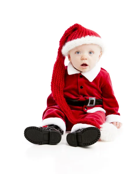 Menino vestido como Papai Noel olha para a câmera — Fotografia de Stock