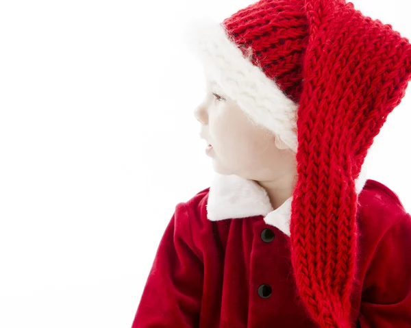 Profil mały chłopczyk przebrany za Świętego Mikołaja. — Zdjęcie stockowe