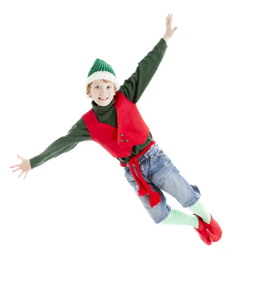 A happy, joyful, red headed boy flies through the air — Stock Photo, Image