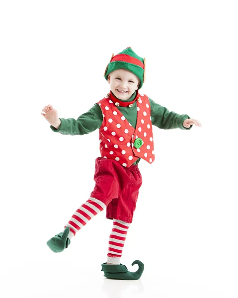 Мальчик, одетый как рождественский эльф, танцует веселый джиг — стоковое фото