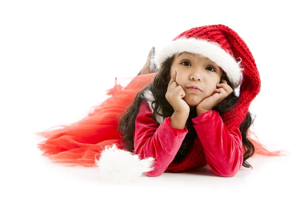 Mixed race little girl dressed like santa daydreams about christ — Stock Photo, Image