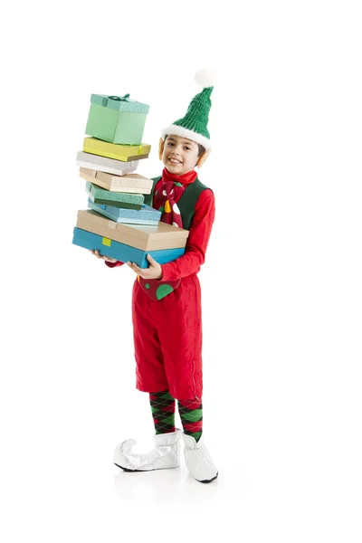 Santas helper elf worstelt met hoge stapel kerstcadeau — Stockfoto