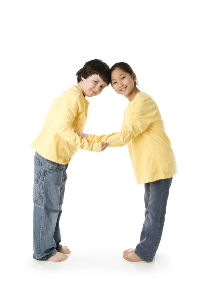 Multicultural children work together to form letter A — Stock Photo, Image