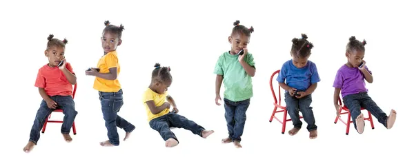Uma montagem de imagem composta de uma menina criança em muitas camisas coloridas — Fotografia de Stock